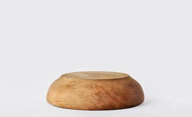Empty wooden pedestal podium. Realistic scene for product display presentation. Wood bowl, upside down, isolated. Brown, warm colors. Minimalist and sustainable product promotion concepts
