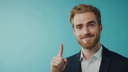 Man pointing finger in suit smiling