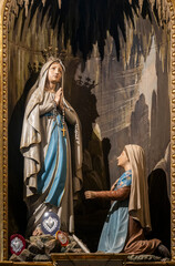Statue (19th century) of Apparition of Our Lady of Lourdes to Bernadette Soubirous.