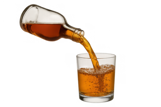 Pouring amber liquid from a bottle into a glass, splashing alcoholic drink on transparent background