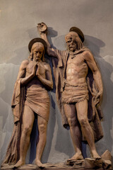 Naklejka premium Statue (19th century) of Baptism of Jesus by John the Baptist in the Jordan river.