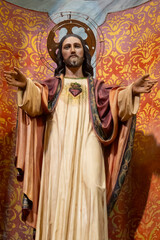 Obraz premium Colorful statue (19th century) of Sacred Heart of Jesus Christ.