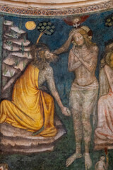 Fresco (14th century) of Baptism of Jesus by John the Baptist in the Jordan river.