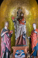 Naklejka premium Statue (19th century) of Blessed Virgin Mary holding baby Jesus Christ in her arms.