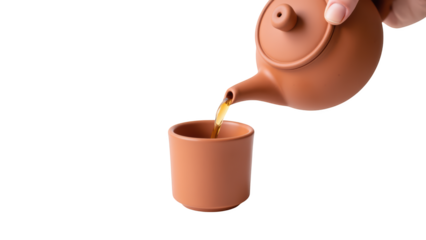 Pouring tea from clay teapot into ceramic cup creates warm and inviting atmosphere
