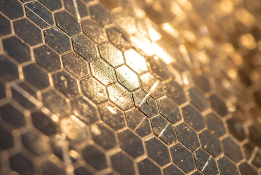 Golden Hexagonal Mirror Texture Resembling Solar Space Telescope