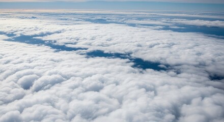 Obraz premium Aerial view of cumulus clouds with blue sky peeking through creating a serene and tranquil