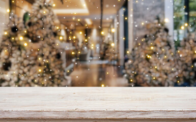 Christmas Decoration with a Focus on Wood: Christmas trees adorned with twinkling lights create a festive atmosphere as a wood foreground creates a perfect place for products 