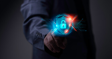 Businessman activates a Cyber Defense shield. Cybersecurity hologram showing Network Security, Firewall protection, and Data Encryption.