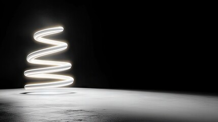 A bright, white, coiled neon light sculpture resembling a spring or DNA helix, positioned on a textured concrete floor in a dark, minimalist studio environment.
