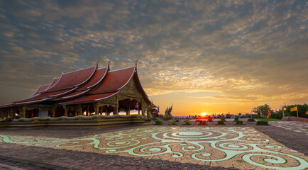 Serene Temple under Sunset: A captivating temple stands proudly beneath a sky painted with the warm hues of the setting sun, exuding a sense of peace and historical significance. © frank29052515