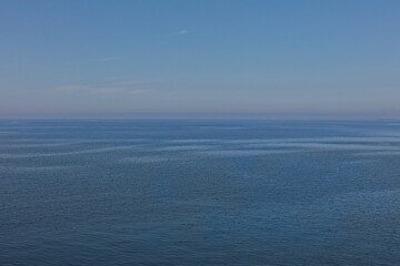 Image of large body of water, horizon under a clear blue sky, water surface has a rippled texture in summer, Gulf of Finland, Finland.