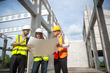 Fototapeta premium construction engineers are discussing project plans on site.