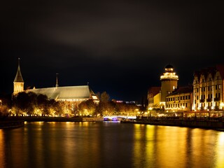 Fototapeta premium The Kaliningrad embankment at night with illumination and bridge