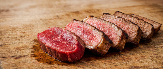 Beef steak doneness degrees from rare to well done slices row comparison meat cooking stages roasting level red pink brown texture culinary guide protein food roast grill kitchen restaurant