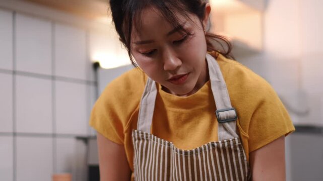 Close-up of Asian woman's hands sorting and arranging fresh vegetables for cooking a healthy mea