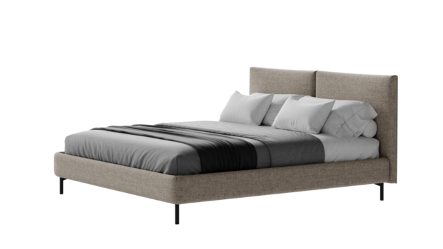 Contemporary bed with comforter and pillows on an isolated background. 