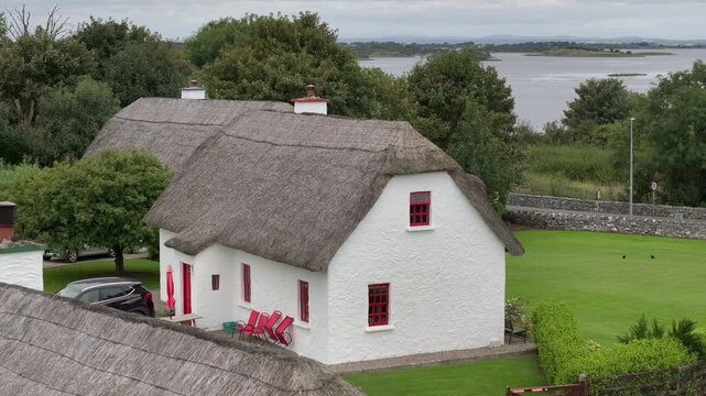 Typical Irish White Washed Houses with Thatched Roof. Authentic and Historical Cozy Cottage in Ireland, Aerial View