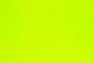Bright neon surface on a flat surface. Lemon-colored background