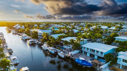 Aerial view of beautiful waterfront canals vacation houses on beautiful sunset 