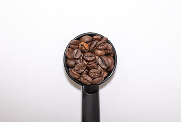 coffee beans in a spoon