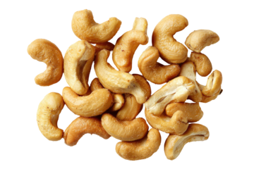 Roasted cashew nuts piled against a black background