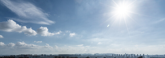 Blue sky with scattered clouds