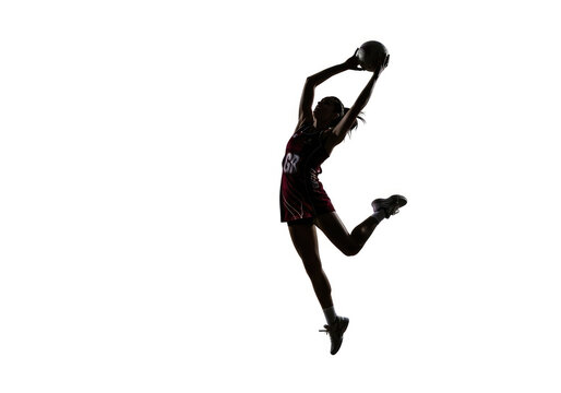 Dynamic Female Basketball Player Jumping for Shot.
