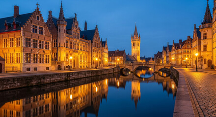 Obraz premium Historic ghent canal at dusk with illuminated buildings and reflections in the water, belgium