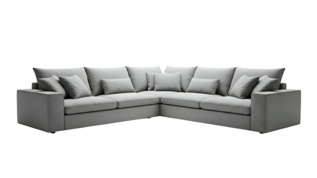 A large, modern, light gray sectional sofa with multiple plush pillows