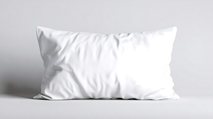 White rectangular pillow mockup presenting soft wrinkled fabric texture, providing comfort and relaxation concept, positioned on a light grey studio background for branding or design promotion