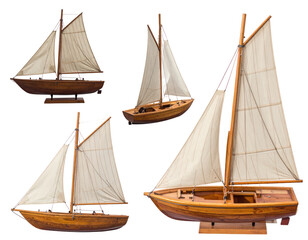 Obraz premium Isolated Wooden Sailboats Collection on Transparent Background Showcasing Marine Transportation And Nautical Themes