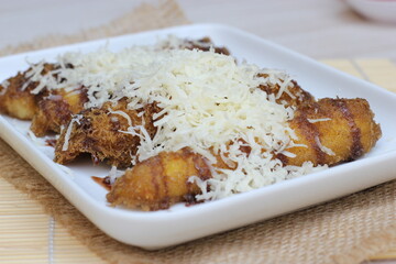 Banana cheese appetizer topped with chocolate
