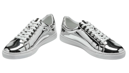 Pair of reflective, metallic silver sneakers with white laces and soles