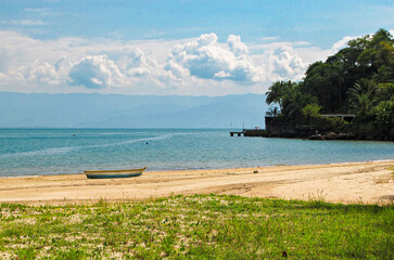 Tropical Beach with Golden Sand and Palm Trees in Ilhabela, Brazil
