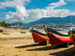 Colorful Canoes on a Sunny Tropical Beach in Ilhabela, Brazil