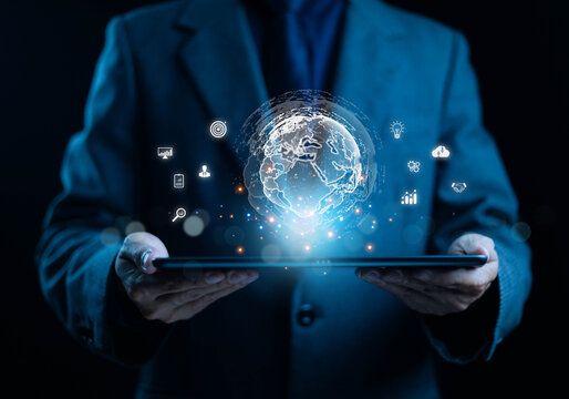 A businessman holding a digital tablet with a glowing global network symbolizing data connectivity international business, digital transformation, smart technology, and worldwide innovation in modern.