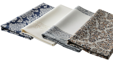 Elegant collection of four folded fabric napkins, each with a unique intricate pattern in shades of blue, cream, and grey, isolated on transparent background