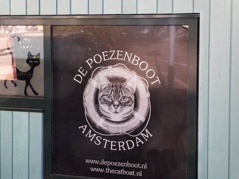 Amsterdam, The Netherlands, September 28, 2025 - Sign on the cat boat (dutch: De Poezenboot), a barge moored in a historic center canal housing abandoned and owner surrendered cats