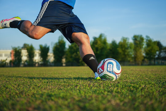 Bangkok, Thailand - 23 November 2025; A football player is training football on training pitch, using "Trionda" the official match ball for FIFA world cup 2026 tournament.