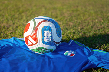 Fototapeta premium Bangkok, Thailand - 23 November 2025; Italy football jersey is placed on football training field with the 