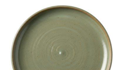 Close-up of a rustic, green ceramic plate with a textured surface, set against black