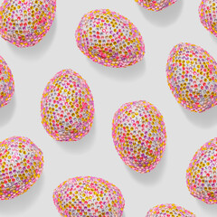 Repeat design of festive painted eggs with vibrant stones, creative greeting card of pink sparkly Chicken egg, minimal pastel pattern, for packaging, social media, Easter food celebration concept.