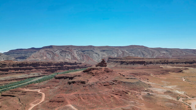 Desert view with rocky slopes and beautiful geological folds next to the valley - Powered by Adobe