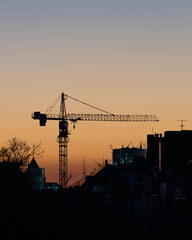 Crane in a fiery Sunset of Duesseldorf Germany in November 2025 - City Developement in the old Steel City of Germany. High quality photo