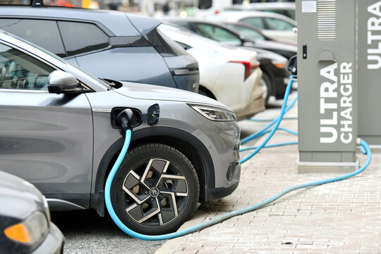 Minsk, Belarus. Feb 14, 2025. BYD electric car at charge station. Parked car charge battery at power station in the city. Ev car charging at Ultra Charger power station. Selective focus