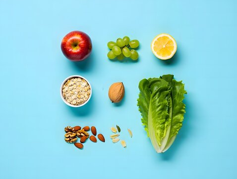 Assortment of fresh fruits vegetables and nuts on blue background