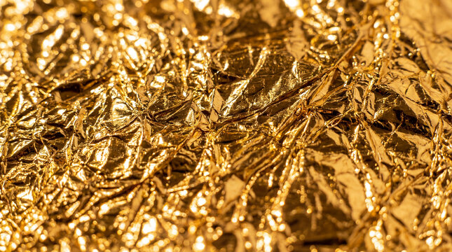 Close-up Abstract of Brightly Crumpled Gold Foil Texture