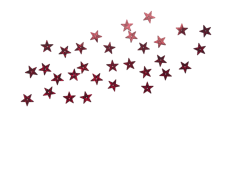 Scattered red and burgundy glitter stars confetti creating a dynamic corner border on a neutral light white background with ample copy space.