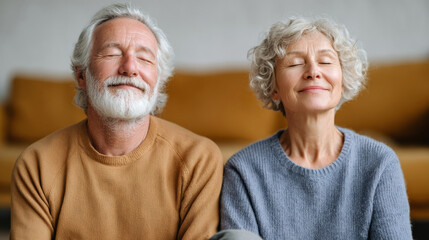 Elderly couple and cat practicing relaxation techniques on couch
